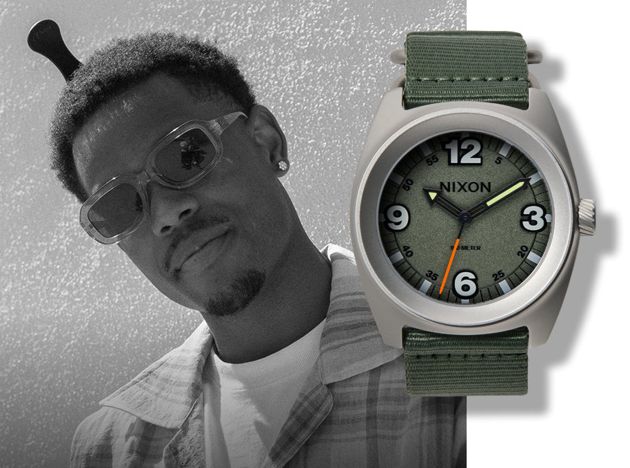 A man in sunglasses and a plaid shirt, partially in black and white, with a color image of a Nixon watch with a green face and green strap.